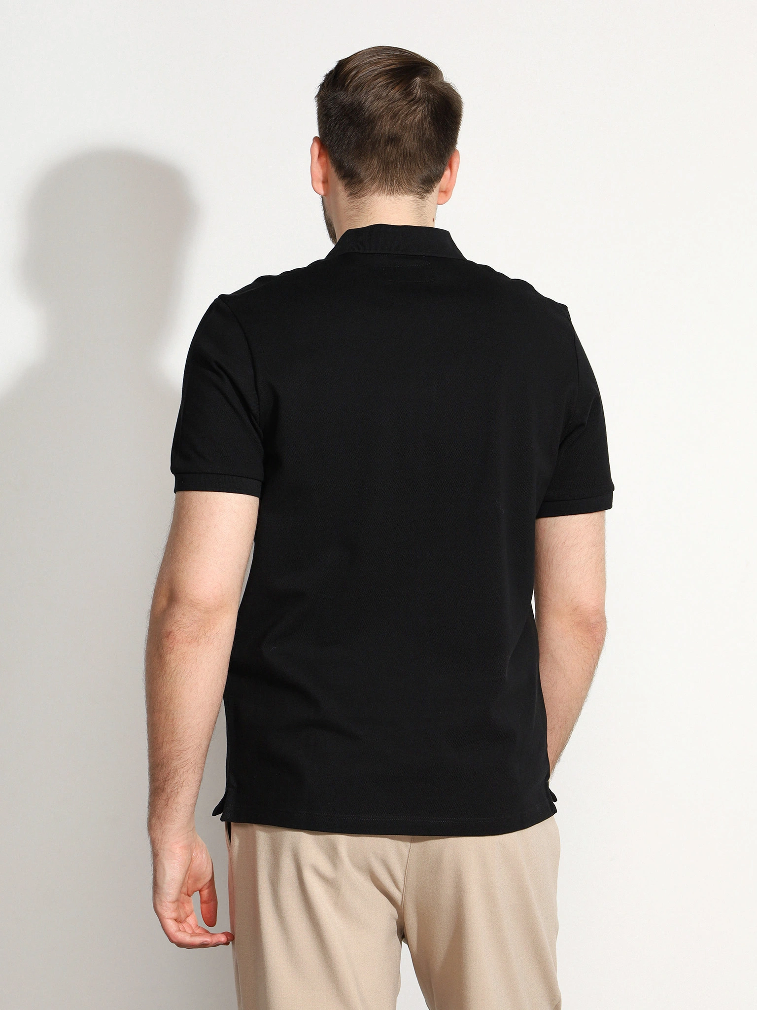 Поло черного цвета из хлопка